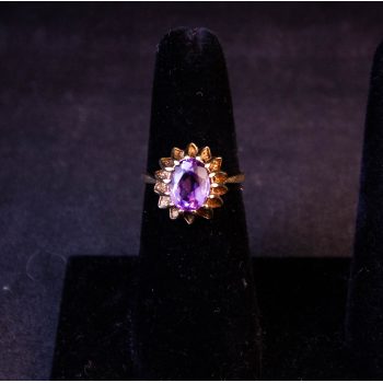 9k yellow gold ring with amethyst in claw setting. Size O. Price includes nationwide delivery.
