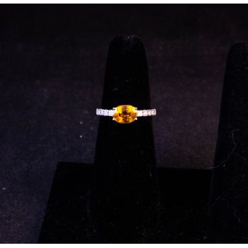 18k white gold ring with yellow sapphire solitaire and 18 diamonds in half eternity shoulders. Total sapphire content 1.28ct, total diamond content .45ct. Size M. Price includes nationwide delivery