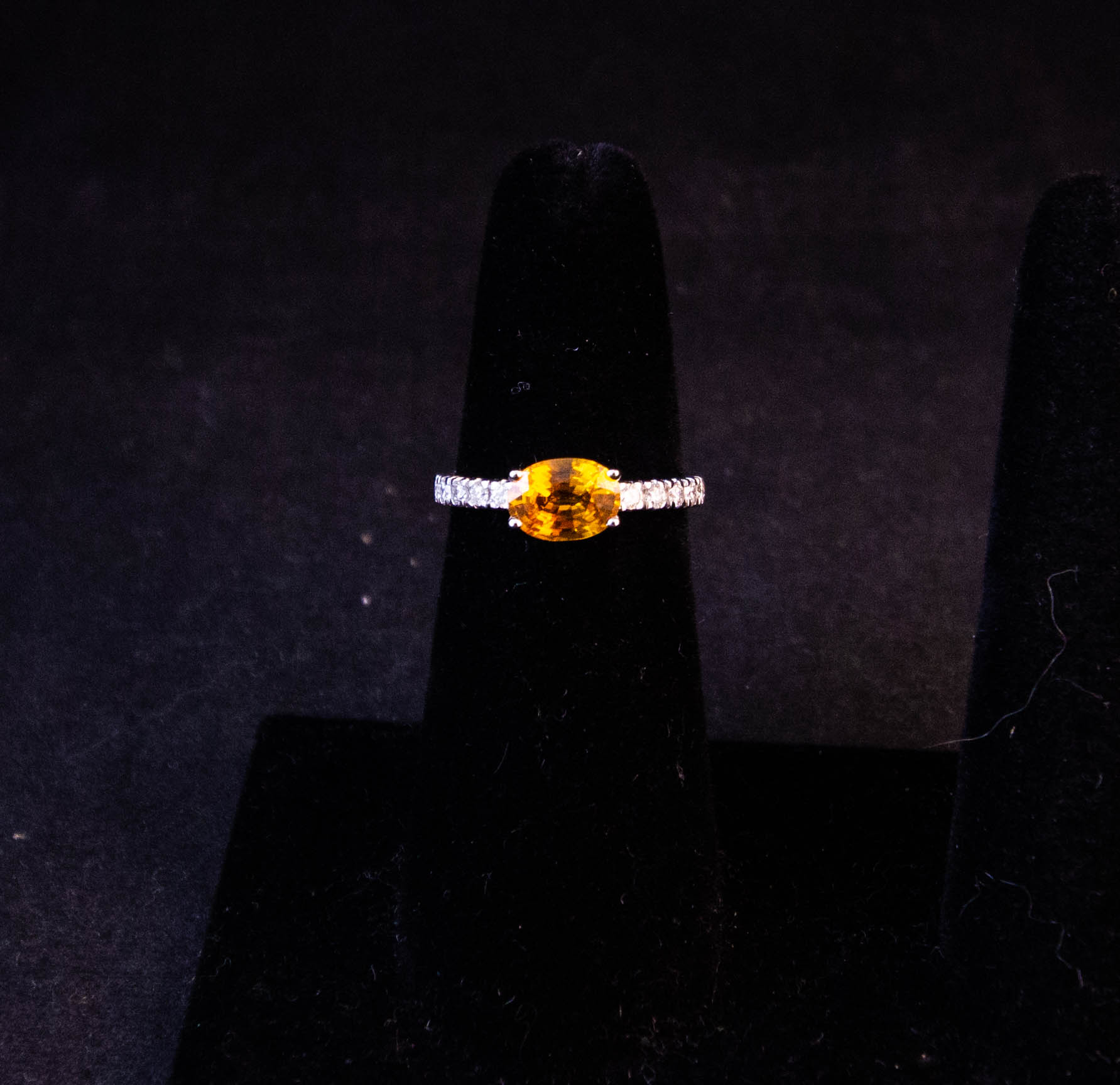 IMG_2433 18k white gold ring with yellow sapphire solitaire and 18 diamonds in half eternity shoulders. Total sapphire content 1.28ct, total diamond content .45ct. Size M. Price includes nationwide delivery