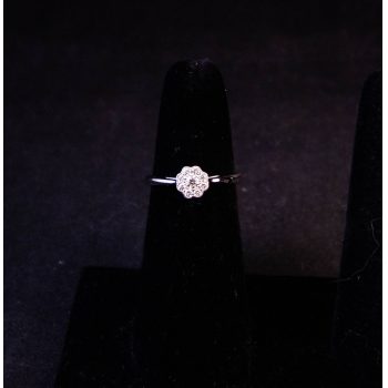 18k white gold daisy pave ring. Total .18ct diamond content. Size L. Price includes nationwide delivery