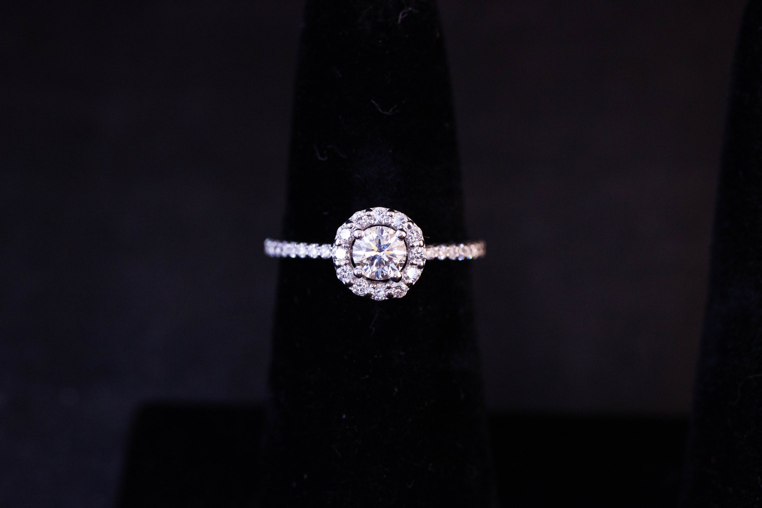IMG_2661 18k white gold and diamond halo solitaire ring with diamond shoulders. Centre diamond .40ct, surrounding diamonds total .38ct. Size L 1/2. Prices include nationwide delivery