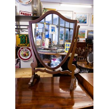 Inlaid mahogany shield shaped dressing mirror. Measures 40w x 22d x 62h in cm. Price includes nationwide delivery
