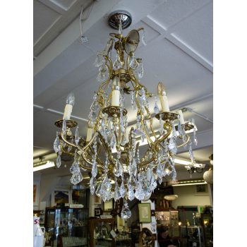 French eight arm brass and crystal chandelier. Measures 100H x 65W cm. Price includes nationwide delivery