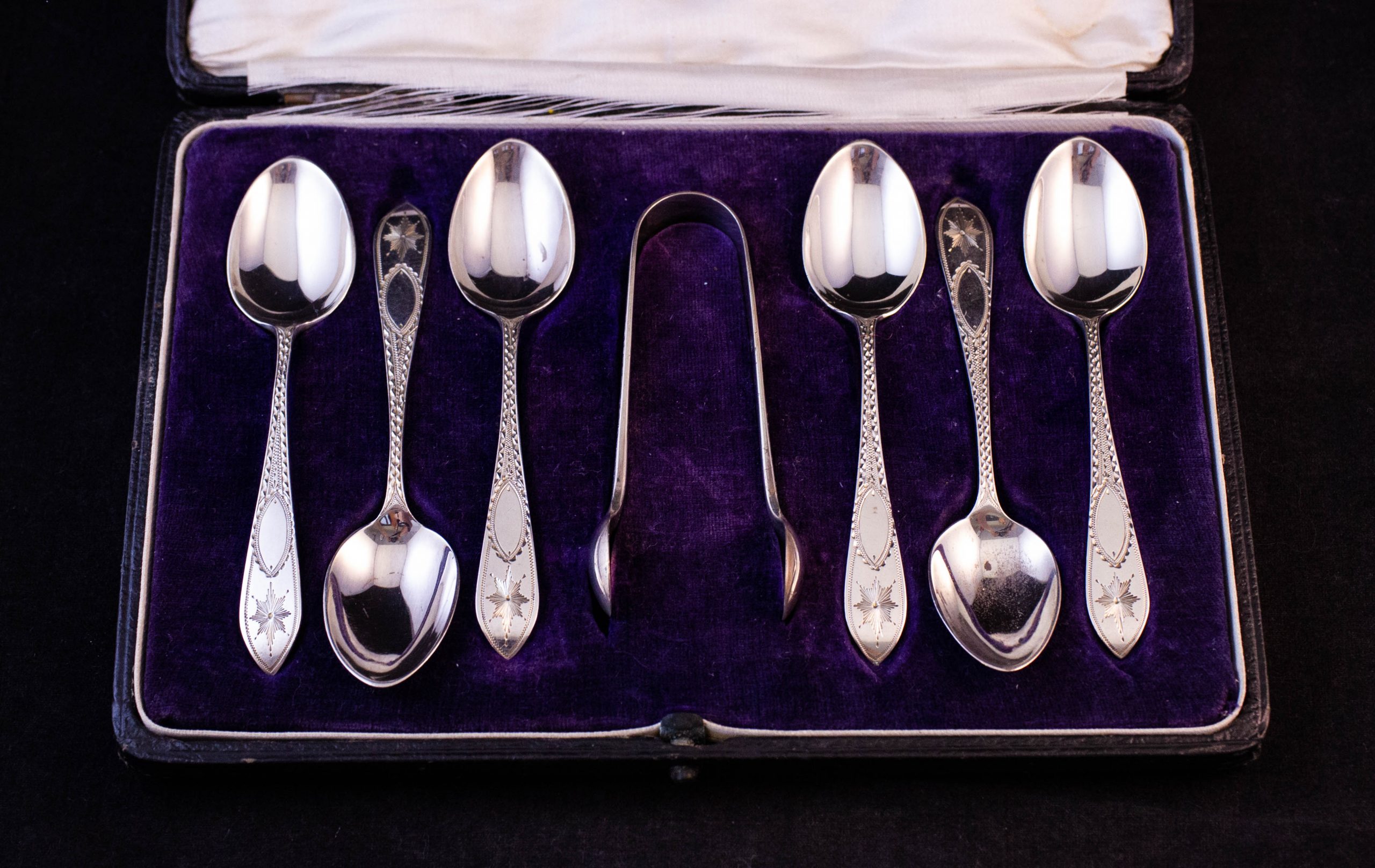IMG_4679 Set of six silver bright-cut tea spoons and sugar tongs in case. Stamped Sharman D. Neill London 1920