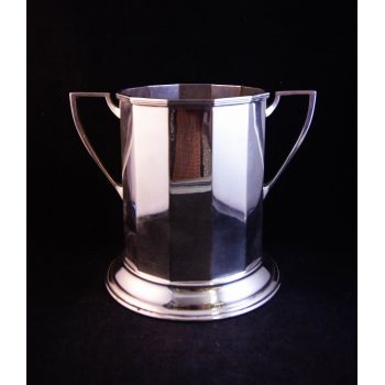 Silver plated bottle coaster. Measures 8"W x 7"H
