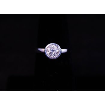 18k white gold solitaire diamond ring in rub over setting. Total diamond .7ct, G SI-1, size M 1/2. Price includes nationwide delivery