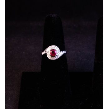 18k white gold ruby ring, surrounded by baguette cut diamonds. Total ruby 1.08ct, total diamond .86ct. Size N. Price includes nationwide delivery.